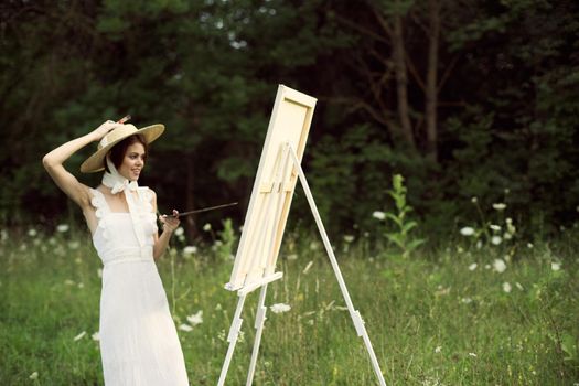 cheerful woman outdoors drawing art landscape hobby. High quality photo