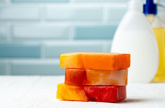 Bar of natural handmade soap on white wooden background. Close up