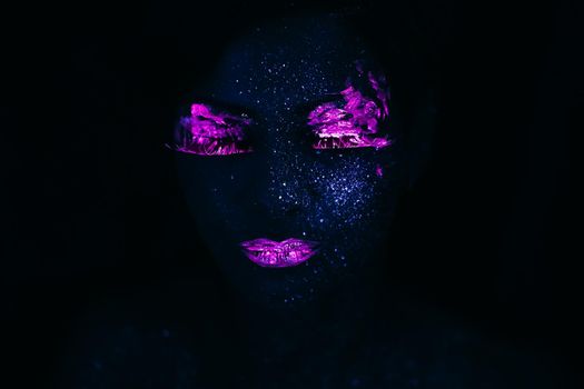 Portrait of Beautiful Fashion Woman in Neon UF Light. Model Girl with Fluorescent Creative Psychedelic MakeUp, Art Design of Female Model in UV, Colorful Abstract Make-Up