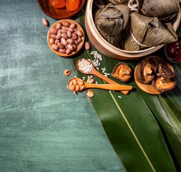 Close up, copy space, top view, flat lay. Famous asian chinese tasty handmade food in duan wu festival, steamed rice dumplings shaped like pyramidal ingredients