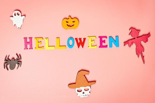 Holiday helloween on a  pink background with a white leaf, pumpkin, ghost, scarecrow, skull, witch