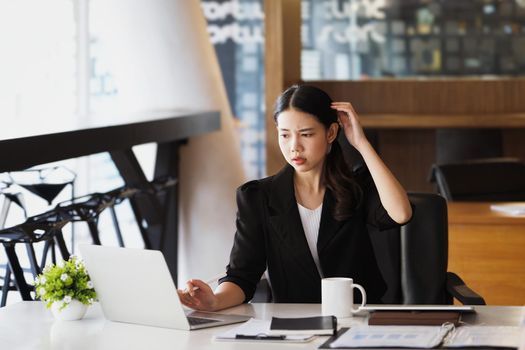 Company employees show boredom from unfinished work using computer notebook, documents and tablets at work