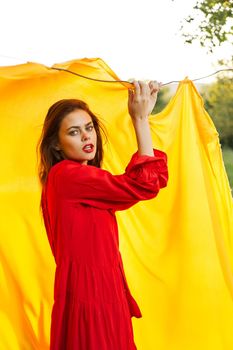 pretty woman nature yellow cloth fresh air glamor. High quality photo