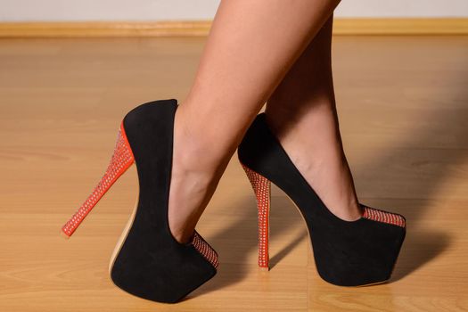 beautiful female legs in stylish shoes with high heels.