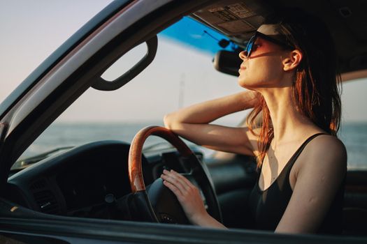 woman driving in car trip posing fashion travel. High quality photo