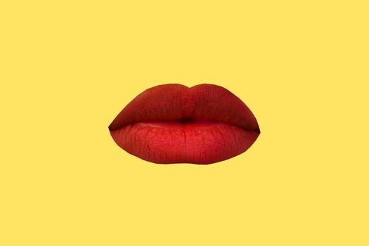 Woman's lips close up isolated on yellow background.