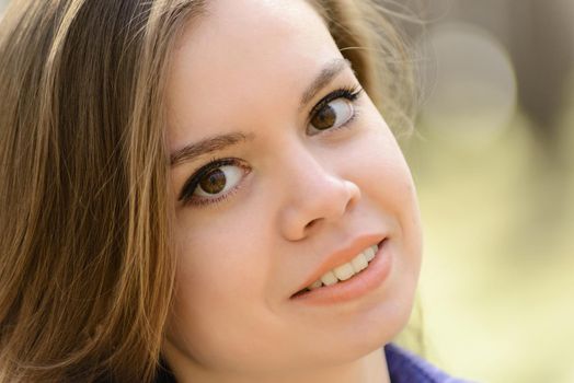 Closeup sensual portrait of beautiful girl outdoors.