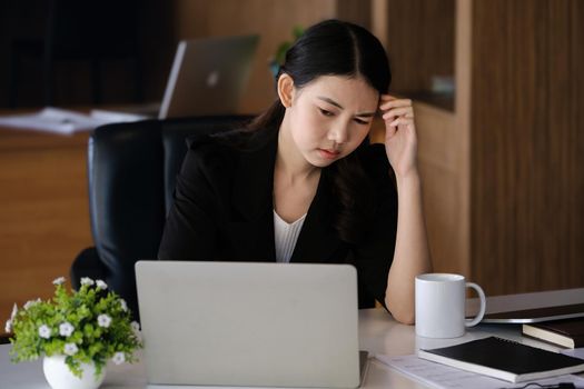 Company employees show boredom from unfinished work using computer notebook, documents and tablets at work