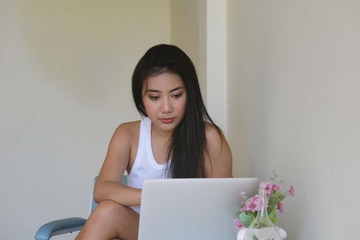 new normal, a businesswoman using computer to work for a company Via the internet on your desk at home