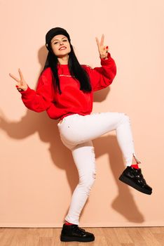 Portrait of funny emotional young woman on pink background - Image