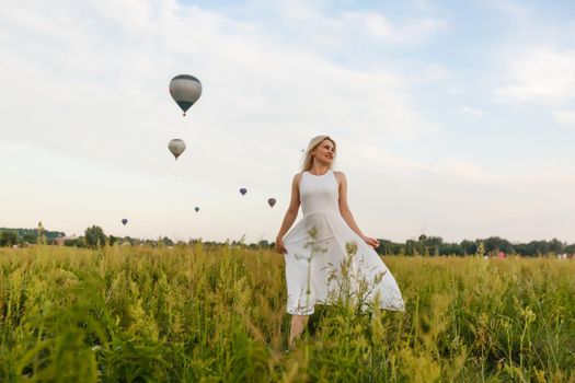 A tourist woman enjoying wonderful view of the balloons. Happy Travel concept