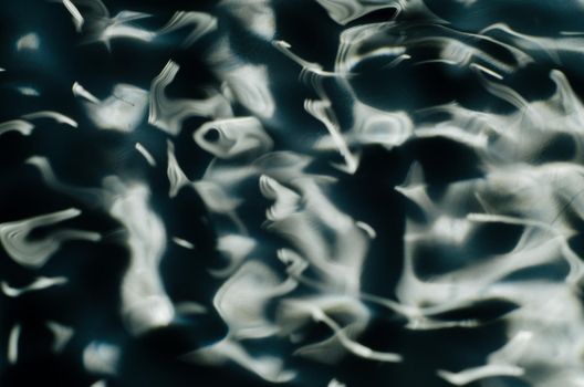 Close up texture of water under the influence of vibration in 432 hertz - image