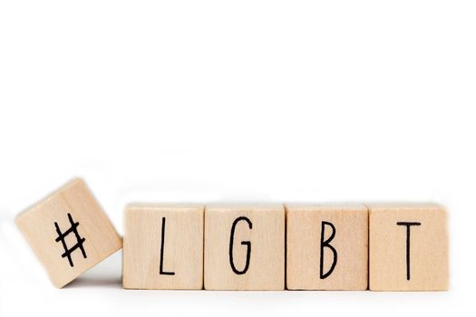 Wooden cubes with a Hashtag and the word LGBT isolated on white, lesbien,gay,bisexual,transgender and social media concept background