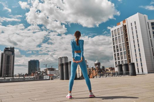 Beautiful fit young woman jogger is running outdoors