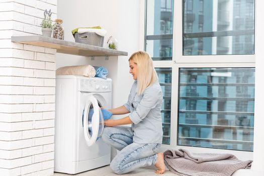 pretty smiling girl in the laundry room