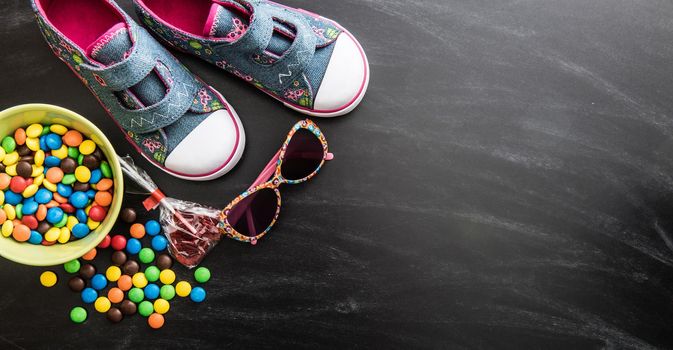 kid's stuff and sweets on a white background