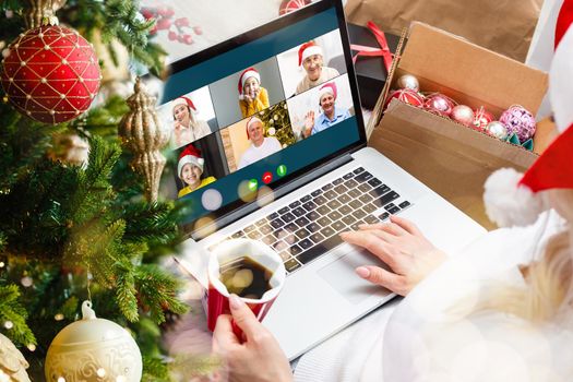 laptop with gift box and christmas lights background