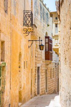 traditional narrow silent street in Maltese Mdina