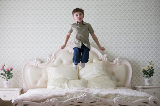 Baby jumping on the bed