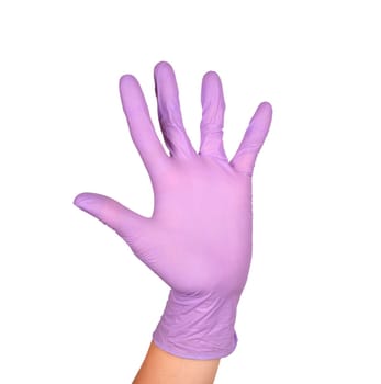 Wave or hi gesture in latex surgical gloved sign against white background. Hand in a purple latex glove isolated on white. Woman's hand gesture or sign isolated on white.