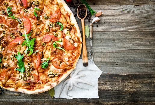 delicious pizza with seafood on wooden table