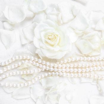 Beautiful white rose with petals and pearl necklace on white background. Ideal for greeting cards for wedding, birthday, Valentine's Day, Mother's Day