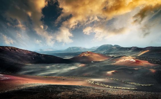 beautiful mountain landscape with volcanoes at sunset in Timanfaya National Park in Lanzarote, Canary Islands