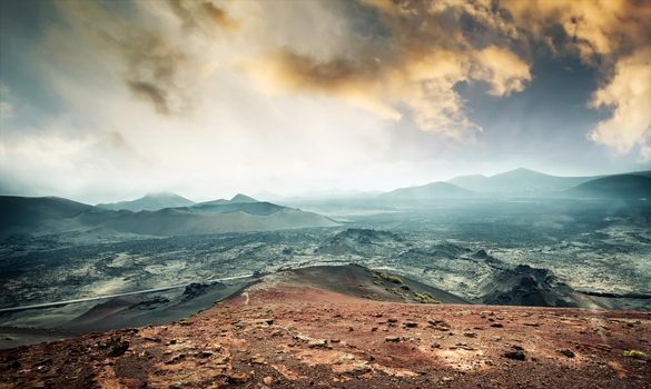 beautiful mountain landscape with volcanoes at sunset in Timanfaya National Park in Lanzarote, Canary Islands