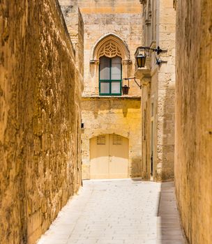 traditional narrow silent street in Maltese Mdina