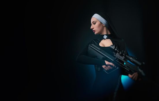 girl on a black background in a nun dress posing with a gun, aiming, shooting