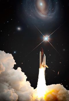 Rockets launch into space on the starry sky. Rocket starts into space concept.Elements of this image furnished by NASA