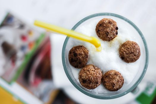 children cappuccino with snacks and straw