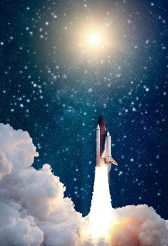 Rockets launch into space on the starry sky. Rocket starts into space concept.Elements of this image furnished by NASA