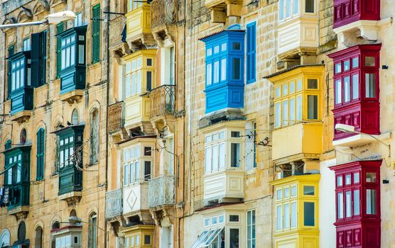 street with colorful balconies in historical part of Valletta in Malta