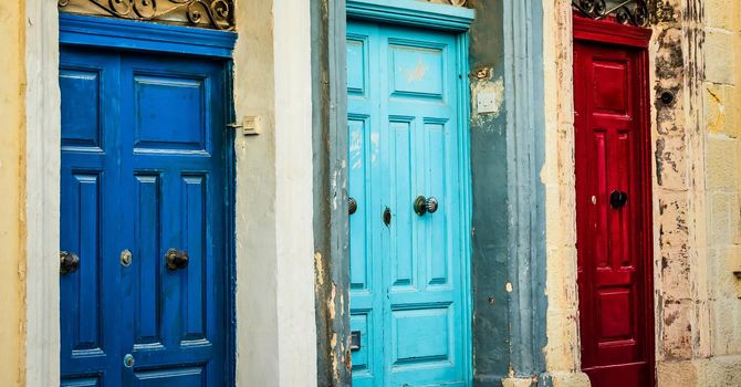 three doors of different color in a street of Valletta in Malta