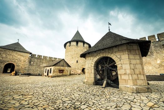 inside yard with houses and wooden stairs of Khotyn Fortress