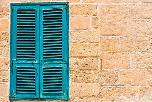 blue wooden window in Mdina, Malta