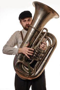 beard man with suspenders and cap holding the tube