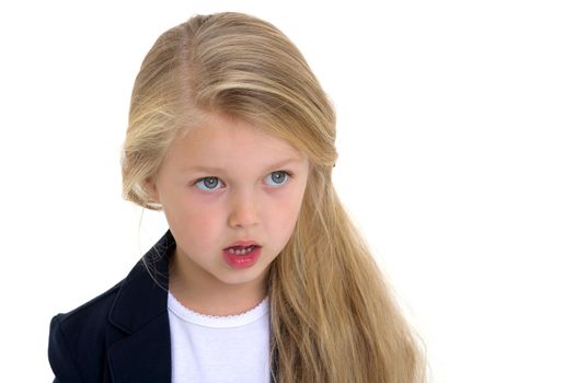 Front view portrait of beautiful little schoolgirl. Adorable blonde long haired girl posing against white background. Cute elementary school student in blue jacket and white blouse