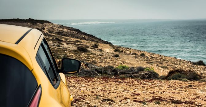car on sea coast background