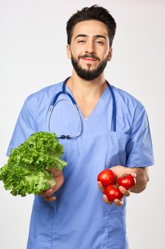 male doctor nutritionist with vegetables in hands healthy food. High quality photo