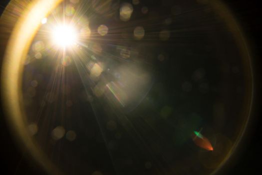 Abstract Natural Sun flare on the black.