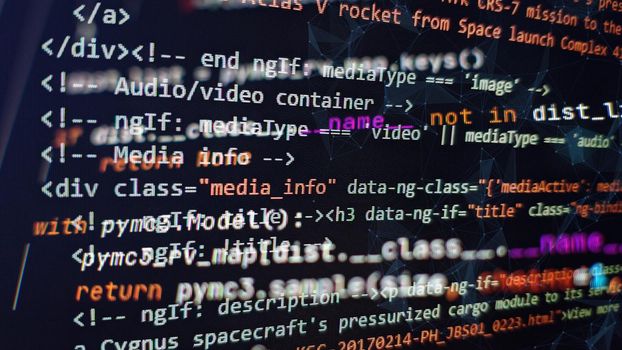 Website development. Developer working on program codes in office. Computer program. Programmer workplace. Programming code. Software source code.