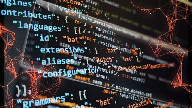 Website development. Developer working on program codes in office. Computer program. Programmer workplace. Programming code. Software source code.