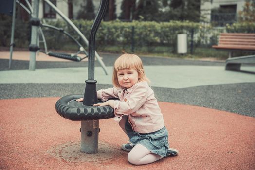 joyful little girl on a playground