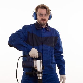 Construction worker stands leaning on the puncher on a white background.