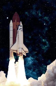 Rocket launch. Rocket with smoke flies into space. Space Shuttle .Spaceship begins the mission. Elements of this image furnished by NASA