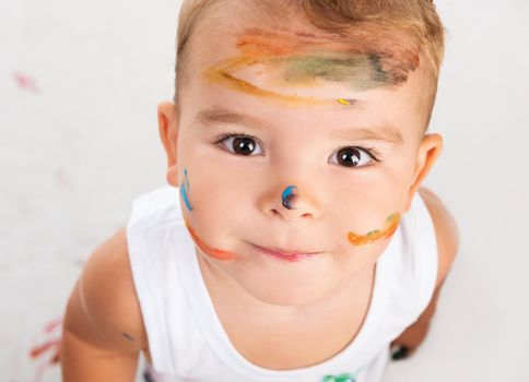 cheerful little boy with painted face portrait