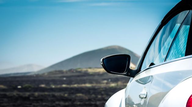 car on offroad by mountain