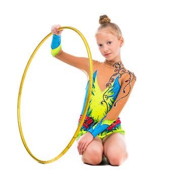 little gymnast sitting on the floor with hoop isolaten on white background